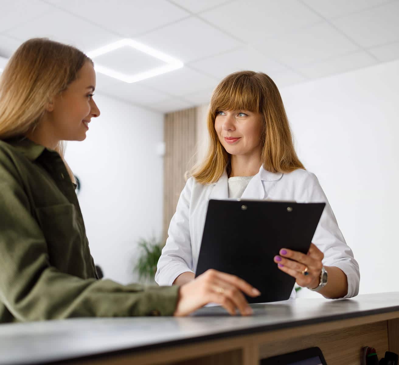 Patient speaking with medical provider during a consultation