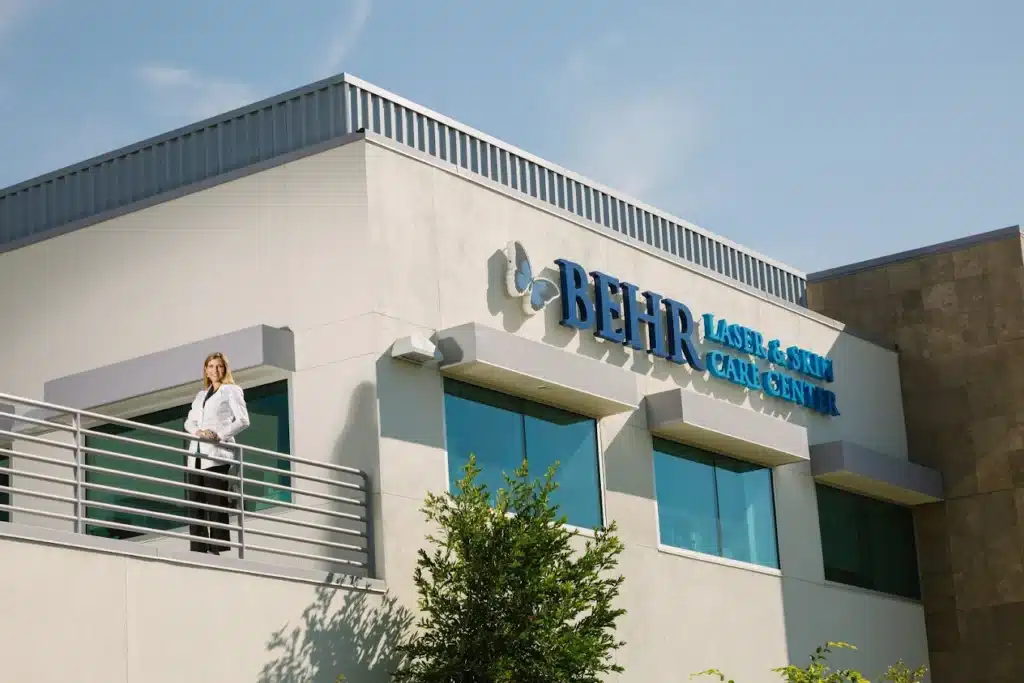 Behr Laser & Skin Care Center building exterior with logo signage and balcony.