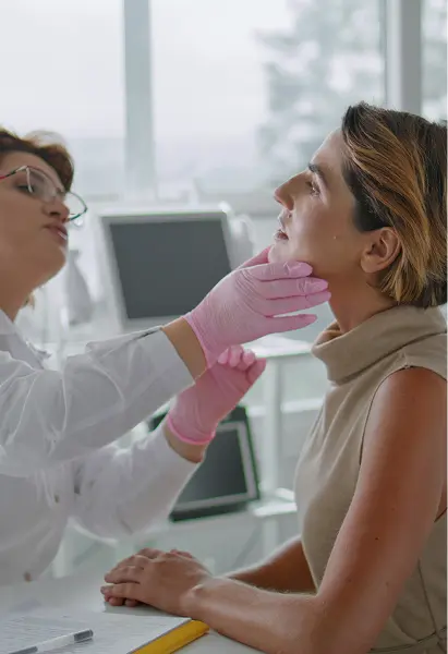 Medical provider examining a patient’s face during an aesthetic consultation